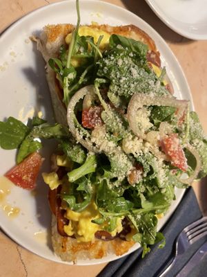 Prosciutto scramble on focaccia   at Lulu Green in Boston