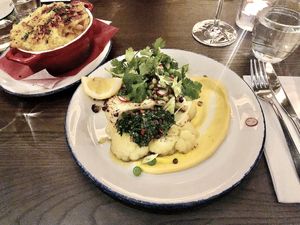Cauliflower steak and vegan mac and cheese.  at Wulf & Lamb Marylebone in London