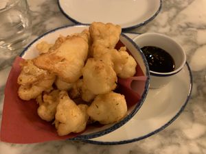 Fried cauliflower with delicious sticky sauce.  at Wulf & Lamb Marylebone in London