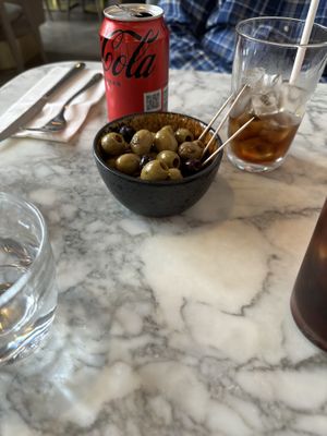 Olive appetizer and Coke Zeroo  at Wulf & Lamb Marylebone in London