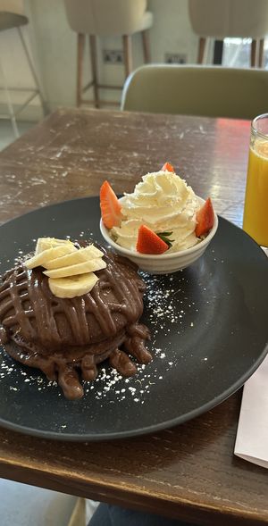  Chocolate pancakes and orange juice   at Wulf & Lamb Marylebone in London