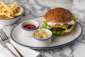 Wulf Burger with French fries at Wulf & Lamb Marylebone in London
