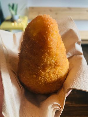Italian arancini with saffron rice & ragú bolognese with sweet peas. at Zilch Bakery & Deli in Glasgow