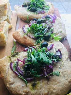 Focaccia with red onion, pesto, black olives & fresh rocket.  at Zilch Bakery & Deli in Glasgow