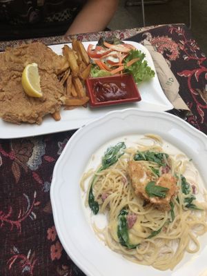 deep fried schnitzel and chips, and creamy carbonara with smoked ‘ham’ and fried ‘shrimp’  at Vegan Loving Hut Neubau in Vienna