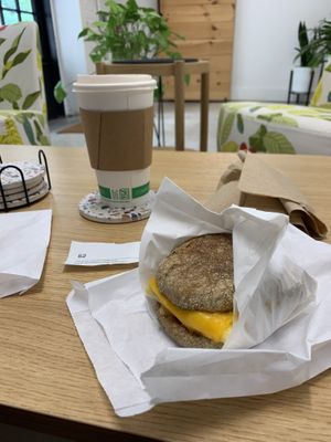 Vanilla latte with oat milk (default) and vegan just egg and gardein sausage English muffin sandwich   at Brewing Good Coffee Company in Savage