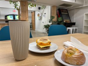 Lemon poppy seed roll and eggie-cheez-snausage in the sitting room  at Brewing Good Coffee Company in Savage