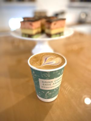 Lavender oat milk latte (and rainbow cookies made by local vegan chef, Amanda Desaulniers) at Brewing Good Coffee Company in Savage