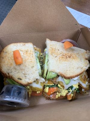 Vegan breakfast sandwich with strawberries and blueberries  at Bliss Cafe in San Luis Obispo