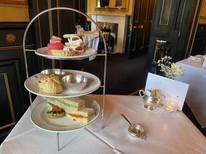 High tea: sandwiches, potato, scone, desserts  at The Georgian Tearoom The Dome in Edinburgh
