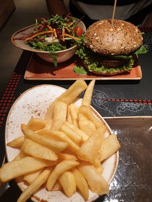 Fries and burger with a side salad at Peter Pane - Pasing in Munich