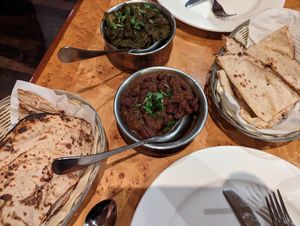 Aloo saag, kidney bean curry and parathas at Marinades Indian Cuisine in Cairns