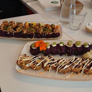 Vegan sushi from top to bottom tempura shrimp, no chicken, mighty mushrooms and California roll at Vegan Sushi Bar - Kinkerstraat in Amsterdam