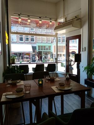 Some of the indoor seating looking out toward the street at Vegan Sushi Bar - Kinkerstraat in Amsterdam