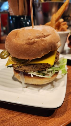Vegan Zesty Mexi burger with added avocado in a panini bun  at Grill'd in Surfers Paradise
