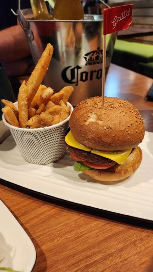 Vegan Impossible Garden Goddness burger in a traditional bun, served with regular chips.  at Grill'd in Surfers Paradise