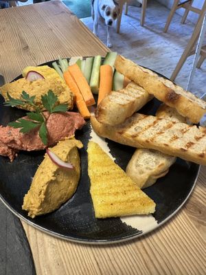 Hummus Plate (with four-legged photo bomber)!  at Avocadisimo in Gran Canaria