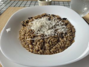 Vegan mushroom risotto with vegan cheese at samsara restaurant in Buzios