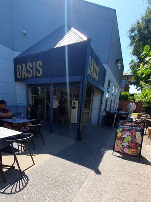 Oasis outside tables and entrance at Oasis in Murrumbeena