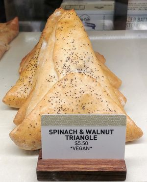 Spinach and walnut triangle at Oasis in Murrumbeena