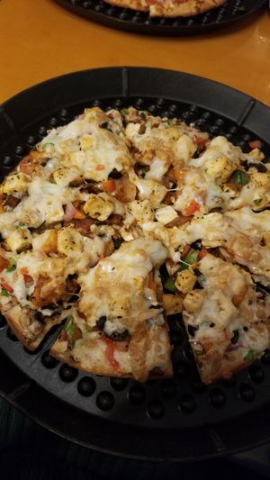 Veggie pizza with tofu, soy chorizo, and vegan cheese at One World in Peoria