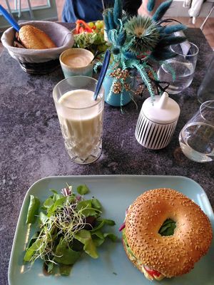 Matcha latte with oat milk, and avocado bagel with side salad at anything but coffee in Mainz