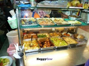 The buffet at Pu Xiang Vegetarian: trays of fried mock meat, a tofu dish, some vegetable dishes, and various deep-fried snacks at the top of the display case.  at Pu Xiang Vegetarian 普香素食 in Central Singapore