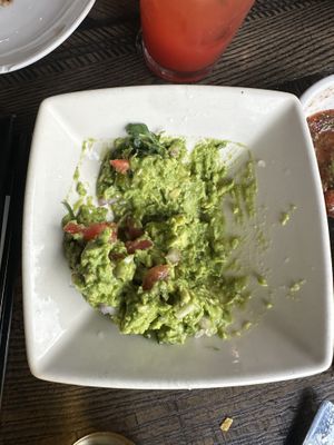 Over priced guac they dumped cheese on the scraped off   at Cantina Laredo in Virginia Beach