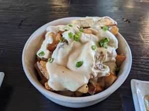 Poutine. The fries were amazing. Next time I'll ask if they are willing to double-fry them. That would be amazing on top of delicious! at The Plot in Oceanside