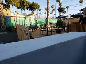 Outdoor parking lot conversation for virus season. at The Plot in Oceanside