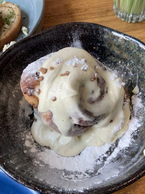 Vegan cinnamon roll with cream  at FACTORY GIRL Restaurant. in Amsterdam