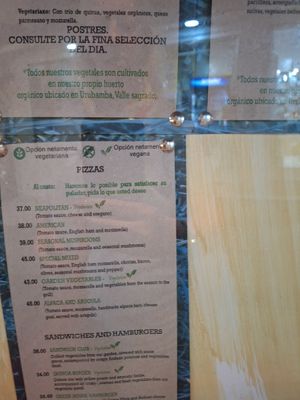 Recent menus and a photo of the entrance. at Green House in Aguas Calientes