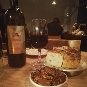 Wine, focaccia and roasted pecans at Gloriosa  in Glasgow