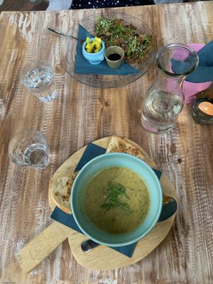 First round: zucchini soup and korean pancakes. They serve free water  at Het Paradijs in Enschede