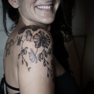 Orchid flowers tattoo on shoulder at Baan Khagee Tattoo Chiang Mai, Thailand at Baan Khagee Tattoo in Chiang Mai