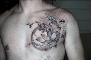 𝙄𝙂: 𝙣𝙖𝙩𝙚_𝙩𝙝𝙖𝙞𝙡𝙖𝙣𝙙 🌿 Ethereal Thai naga tattoo with lotus flower and Thai art on the chest at Baan Khagee Tattoo Chiang Mai, Thailand at Baan Khagee Tattoo in Chiang Mai