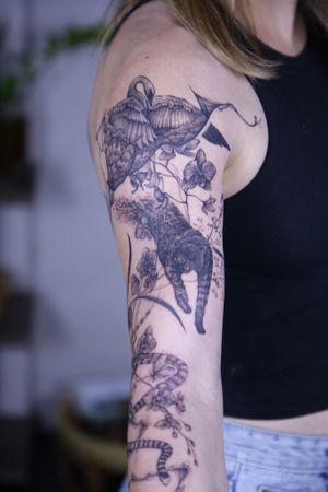 𝙄𝙂: 𝙣𝙖𝙩𝙚_𝙩𝙝𝙖𝙞𝙡𝙖𝙣𝙙 🌿 Blackwork animals sleeve tattoo with nature and orchid flowers by Nate, a blackwork tattoo artist in Chiang Mai, Th at Baan Khagee Tattoo in Chiang Mai