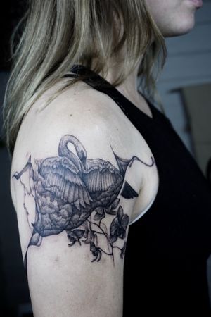 𝙄𝙂: 𝙣𝙖𝙩𝙚_𝙩𝙝𝙖𝙞𝙡𝙖𝙣𝙙 🌿 Black and grey abstract swan tattoo with orchid flowers by a black and grey tattooist in Chiang Mai, Thaialnd at Baan Khagee Tattoo in Chiang Mai