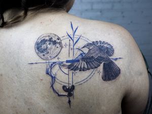 𝙄𝙂: 𝙣𝙖𝙩𝙚_𝙩𝙝𝙖𝙞𝙡𝙖𝙣𝙙 🌿Blackwork Mockingbird and moon tattoo with fine line geometrics and blue abstract flow by Nate, a tattoo artist in C at Baan Khagee Tattoo in Chiang Mai