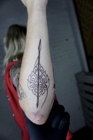 𝙄𝙂: 𝙣𝙖𝙩𝙚_𝙩𝙝𝙖𝙞𝙡𝙖𝙣𝙙 🌿Blackwork fine line spear tattoo with Thai fine art by a Thai tattooist in Chiang Mai, Thailand  at Baan Khagee Tattoo in Chiang Mai
