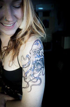 𝙄𝙂: 𝙣𝙖𝙩𝙚_𝙩𝙝𝙖𝙞𝙡𝙖𝙣𝙙 🌿 Fine line octopus tattoo with fine line blue flowers by Baan Khagee Tattoo Chiang Mai, Thailand at Baan Khagee Tattoo in Chiang Mai