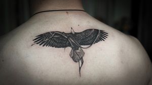 𝙄𝙂: 𝙣𝙖𝙩𝙚_𝙩𝙝𝙖𝙞𝙡𝙖𝙣𝙙 🌿 Blackwork eagle tattoo with abstract flow by a tattoo artist in Chiang Mai, Thailand at Baan Khagee Tattoo in Chiang Mai