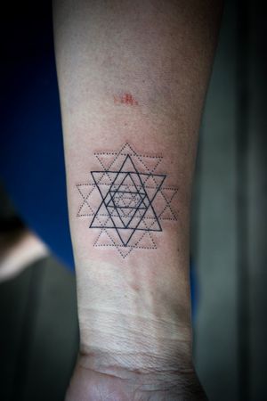 𝙄𝙂: 𝙣𝙖𝙩𝙚_𝙩𝙝𝙖𝙞𝙡𝙖𝙣𝙙 🌿 Fine line Sri Yantra tattoo by a fine line tattooist at Baan Khagee Tattoo Chiang Mai, Thailand at Baan Khagee Tattoo in Chiang Mai