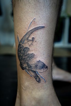 𝙄𝙂: 𝙣𝙖𝙩𝙚_𝙩𝙝𝙖𝙞𝙡𝙖𝙣𝙙 🌿 Blackwork otter tattoo with a weeping willow tree by a Thai tattoo artist in Chiang Mai, Thailand at Baan Khagee Tattoo in Chiang Mai