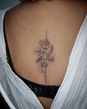 𝙄𝙂: 𝙣𝙖𝙩𝙚_𝙩𝙝𝙖𝙞𝙡𝙖𝙣𝙙 🍃 Fine line flower bouquet tattoo with abstract flow by a Thai tattoo artist in Chiang Mai, Thailand  at Baan Khagee Tattoo in Chiang Mai