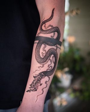 𝙄𝙂: 𝙣𝙖𝙩𝙚_𝙩𝙝𝙖𝙞𝙡𝙖𝙣𝙙 🍃 Blackwork Thai Naga tattoo by Baan Khagee Tattoo Chiang Mai, Thailand at Baan Khagee Tattoo in Chiang Mai