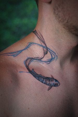 𝙄𝙂: 𝙣𝙖𝙩𝙚_𝙩𝙝𝙖𝙞𝙡𝙖𝙣𝙙 🍃 Koi fish tattoo with blue flow on the neck by Baan Khagee Tattoo Chiang Mai, Thailand  at Baan Khagee Tattoo in Chiang Mai