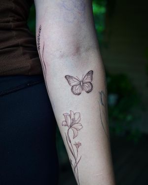 𝙄𝙂: 𝙣𝙖𝙩𝙚_𝙩𝙝𝙖𝙞𝙡𝙖𝙣𝙙 🍃 Fine line butterfly tattoo by Baan Khagee Tattoo Chiang Mai, Thailand at Baan Khagee Tattoo in Chiang Mai