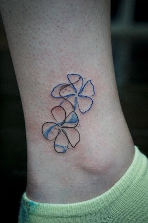 𝙄𝙂: 𝙣𝙖𝙩𝙚_𝙩𝙝𝙖𝙞𝙡𝙖𝙣𝙙 🍃 Minimal fine line Plumeria flower tattoo by Baan Khagee Tattoo Chiang Mai, Thailand at Baan Khagee Tattoo in Chiang Mai