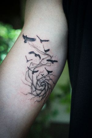 𝙄𝙂: 𝙣𝙖𝙩𝙚_𝙩𝙝𝙖𝙞𝙡𝙖𝙣𝙙 🍃 Blackwork flying black birds tattoo in galaxy by Baan Khagee Tattoo Chiang Mai, Thailand at Baan Khagee Tattoo in Chiang Mai